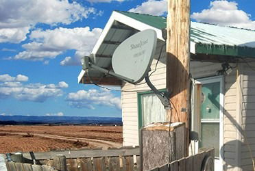 satellite dish on power pole