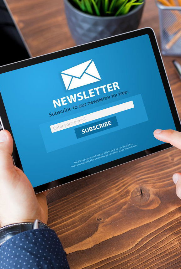 Notepad showing newsletter on screen