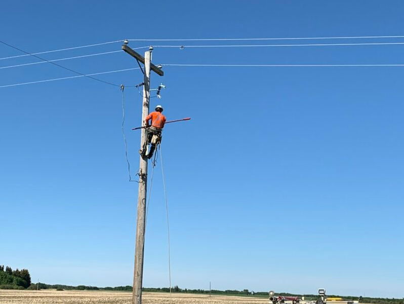 power line technician and lift truck