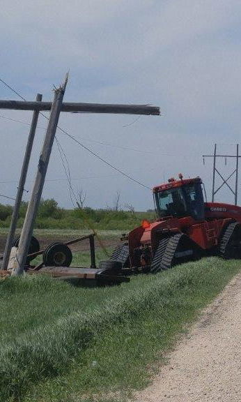 powerline downed by farm tractor