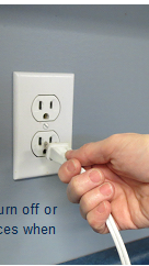 hand pulling plug from socket