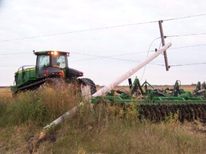 Tractors can cause power pole and line accidents if people do not look up and around for them and aren't aware of their surroundings. 